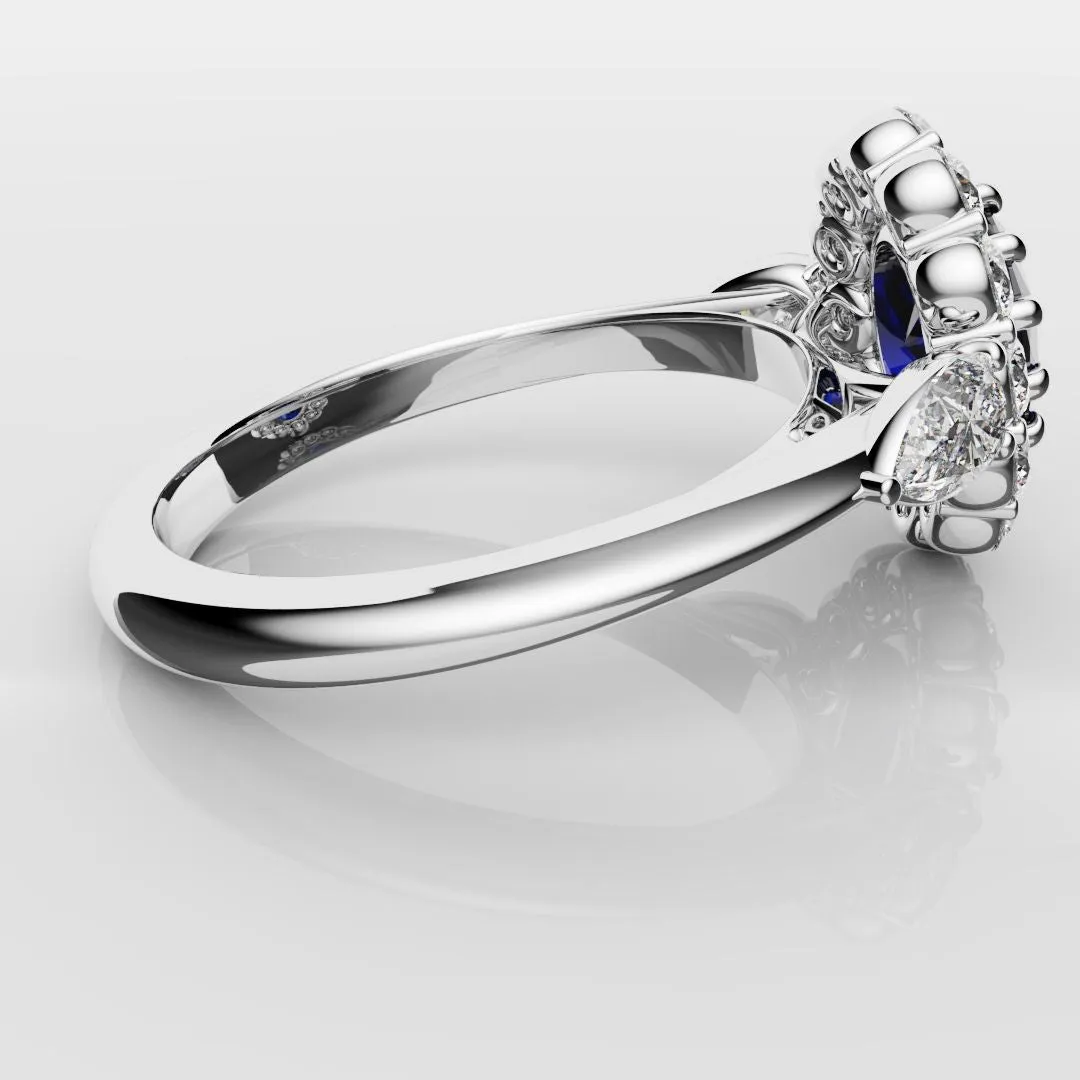 Oval Sapphire Cluster With Pear Shoulder Diamonds