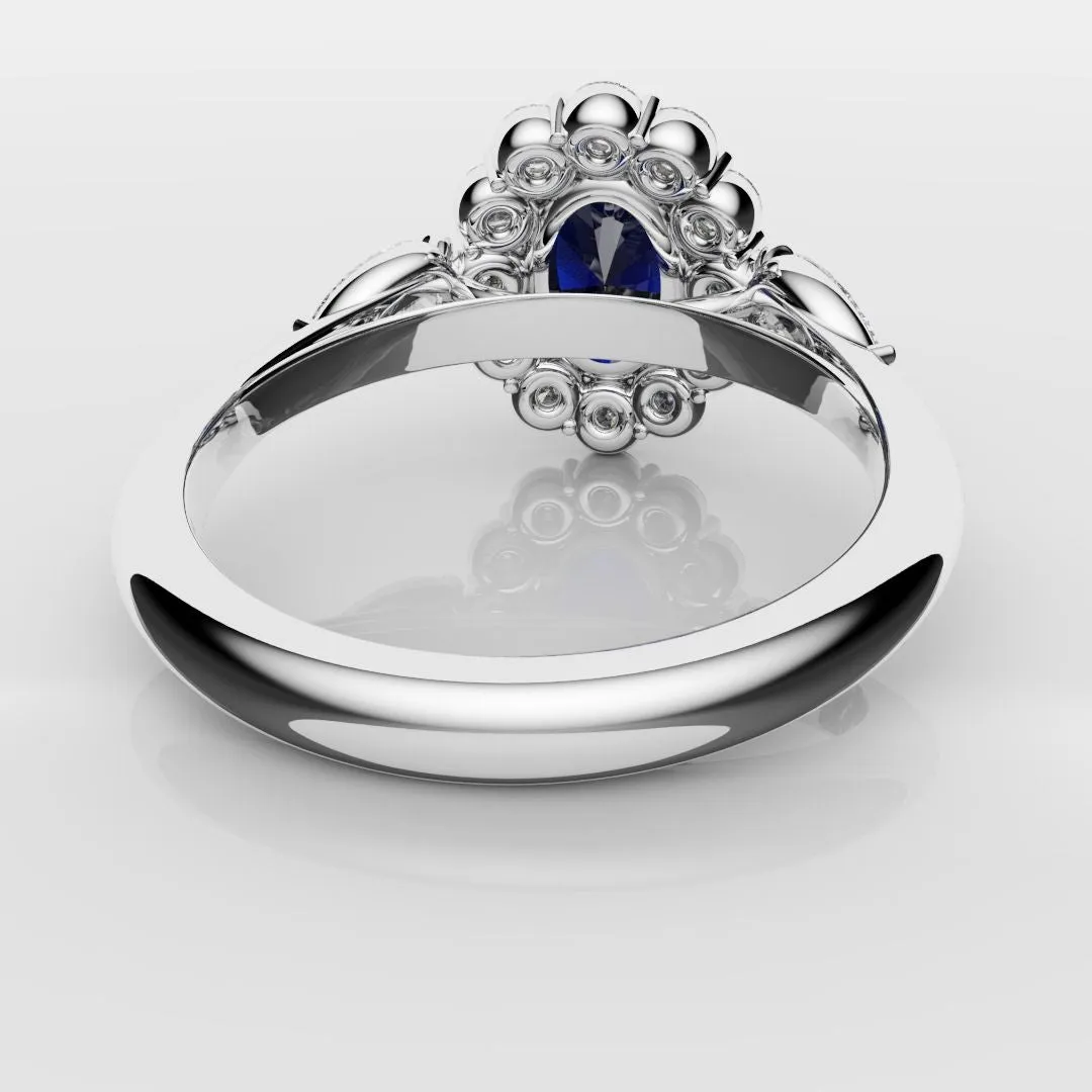 Oval Sapphire Cluster With Pear Shoulder Diamonds
