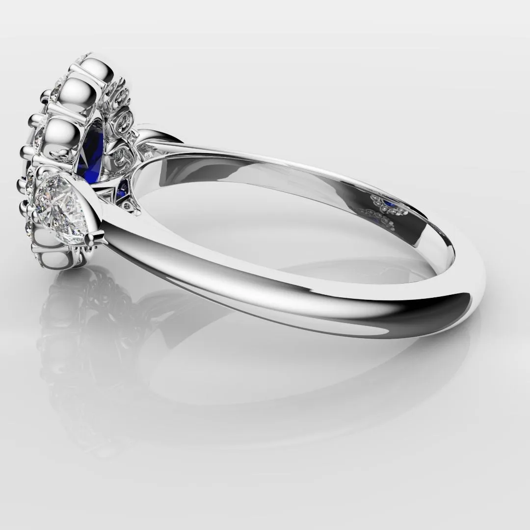 Oval Sapphire Cluster With Pear Shoulder Diamonds