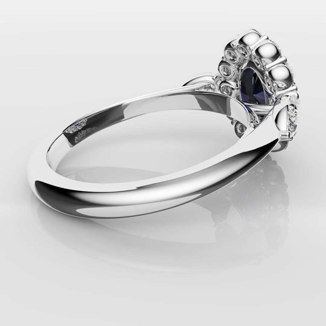 Oval Sapphire Cluster With Pear Shoulder Diamonds
