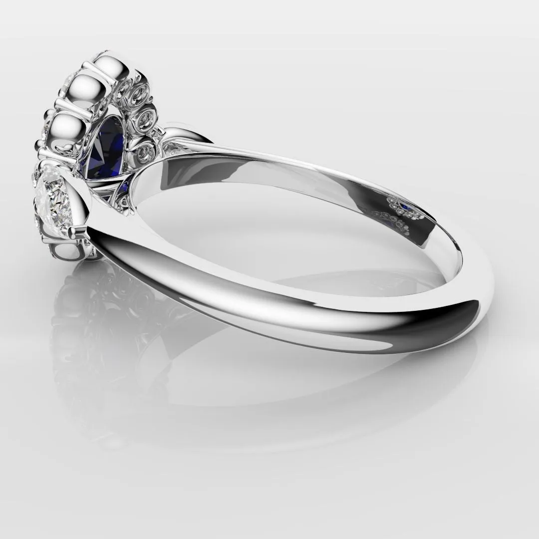 Oval Sapphire Cluster With Pear Shoulder Diamonds
