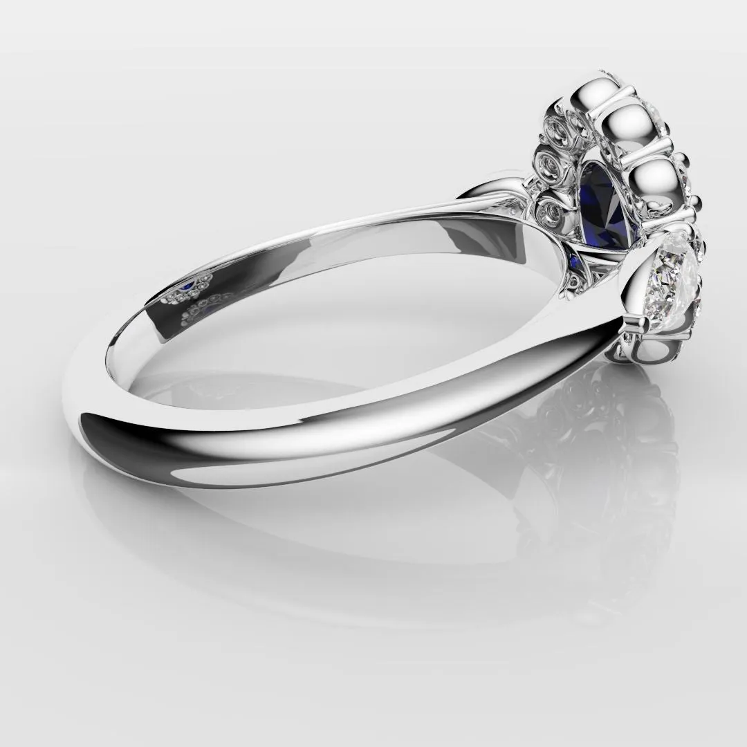 Oval Sapphire Cluster With Pear Shoulder Diamonds