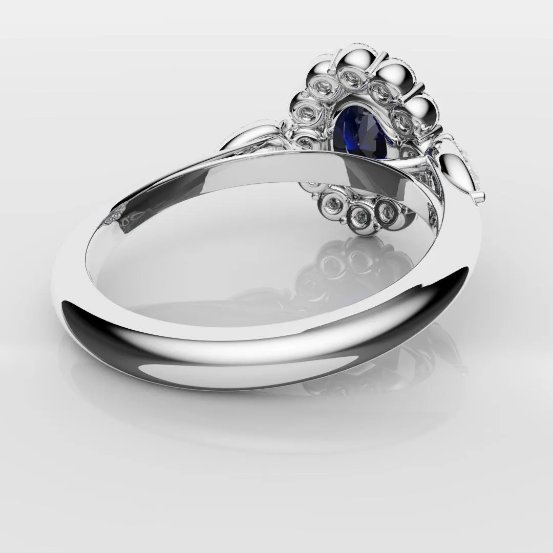 Oval Sapphire Cluster With Pear Shoulder Diamonds