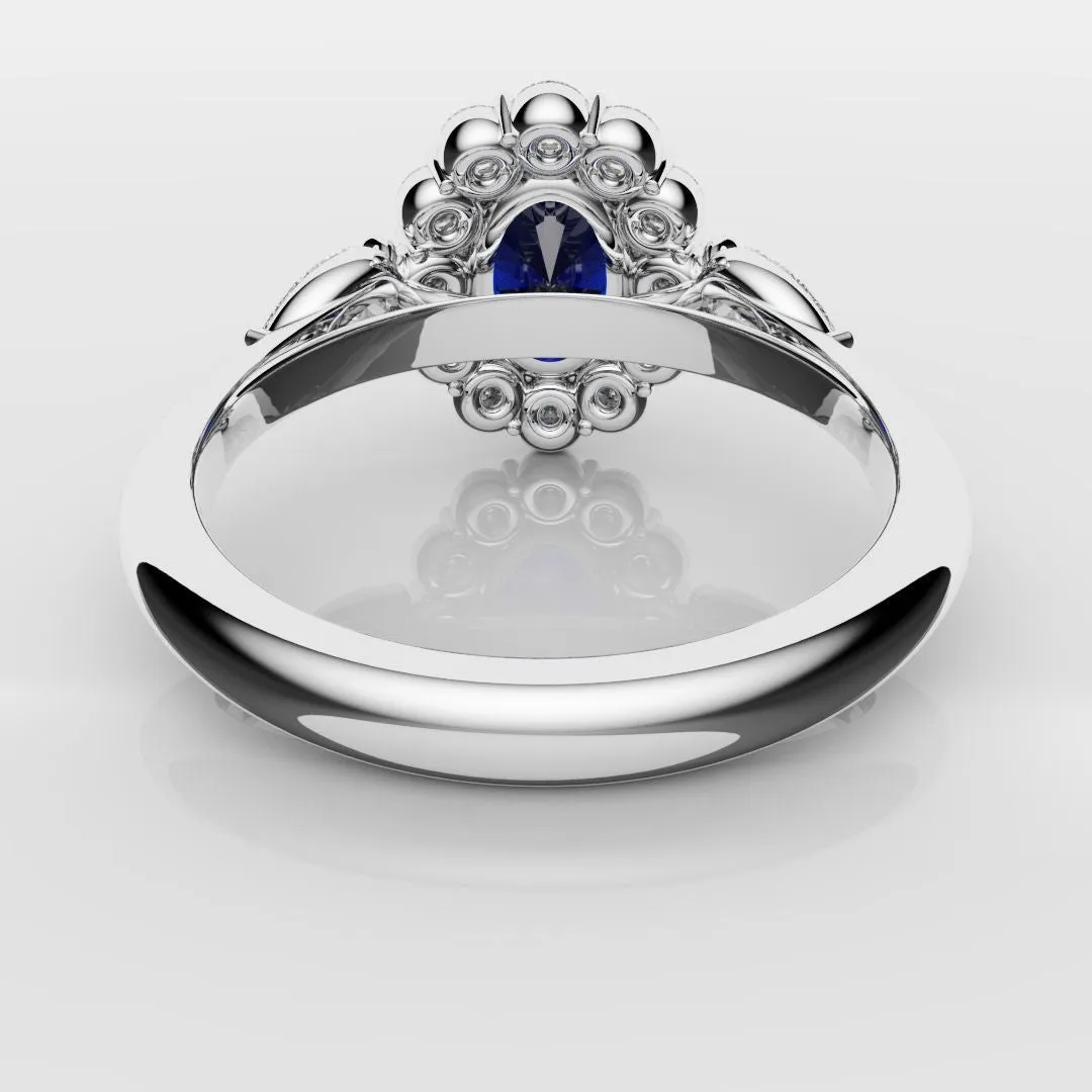 Oval Sapphire Cluster With Pear Shoulder Diamonds